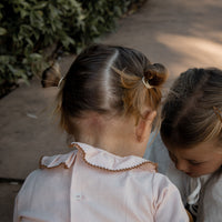 BLUSA BEBÉ ROSA EMPOLVADO